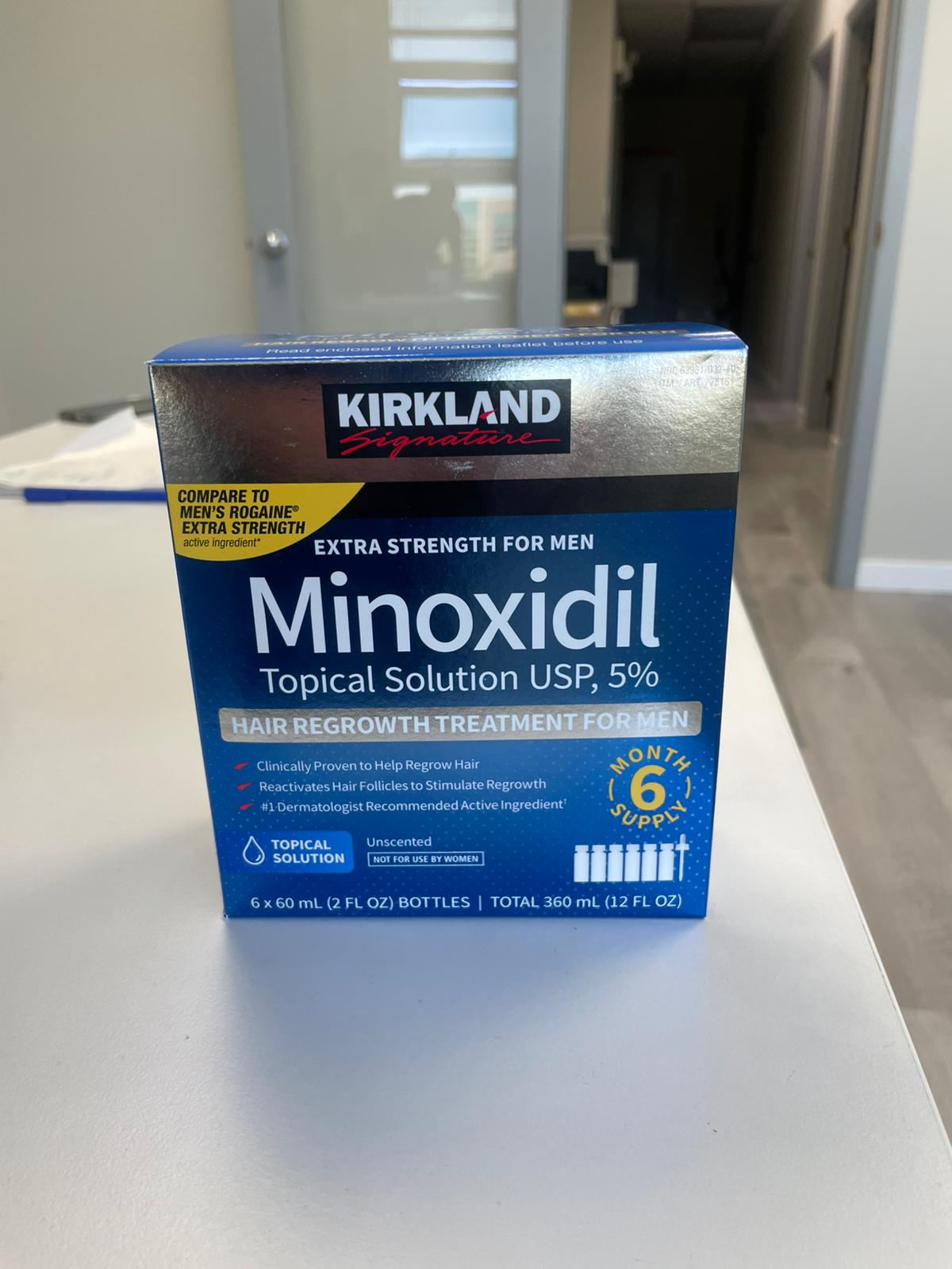 Kirkland Minoxidil topical solution box on a white surface